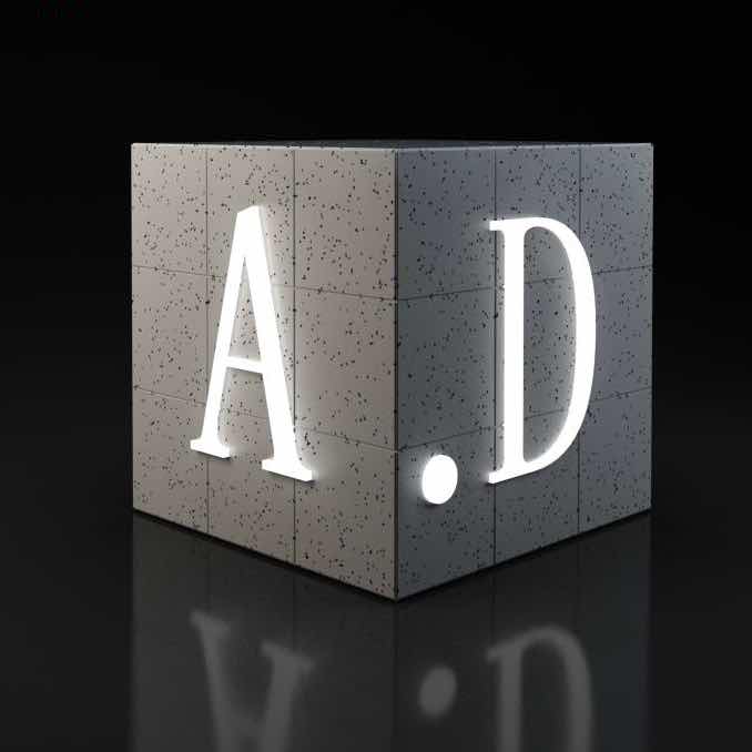 Source image for Glowing Concrete Cube Letters A.D Rotate on Black Background