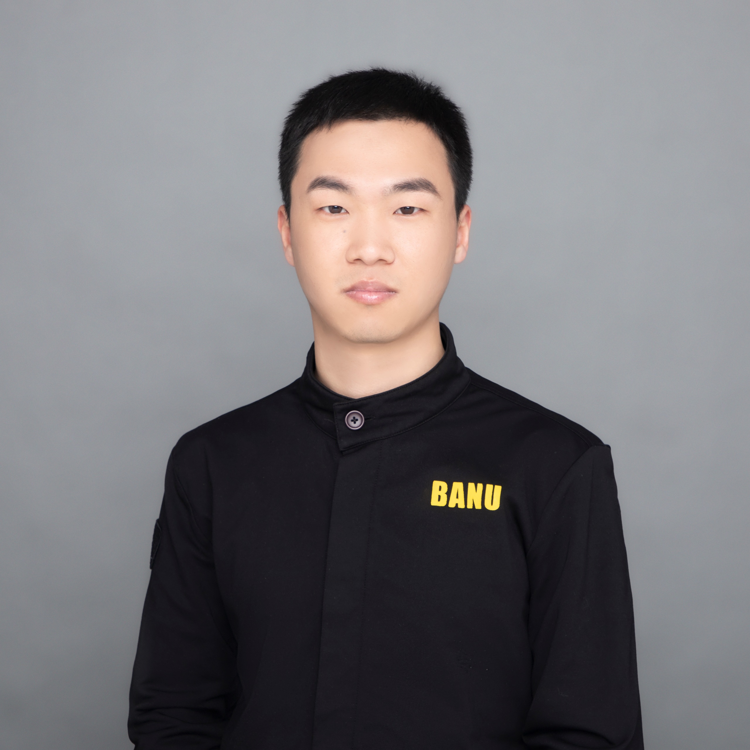 Source image for Serious Portrait Man in Black BANU Jacket Reacts to Camera Zoom