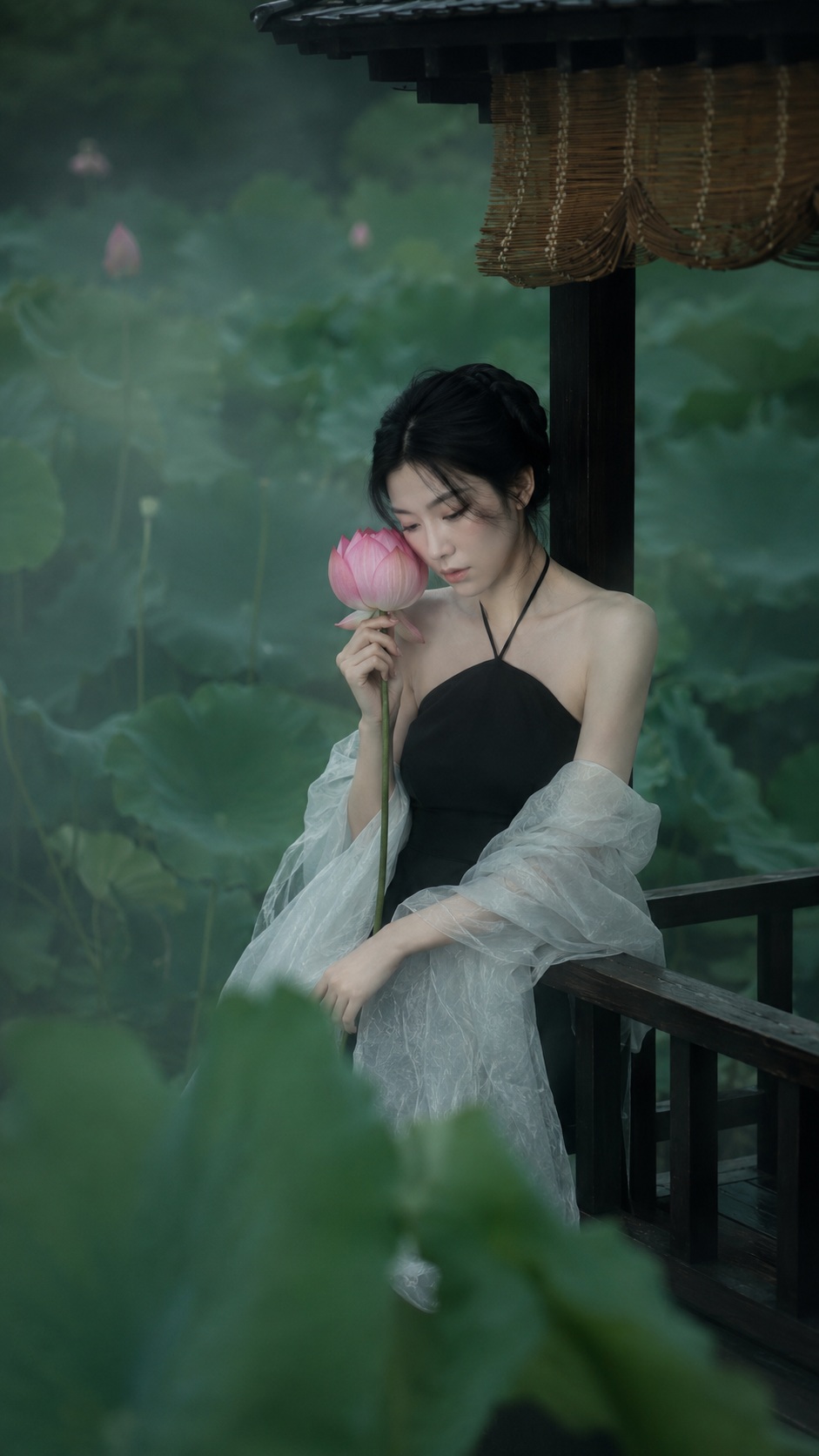 Source image for Serene Woman Sniffing Pink Lotus Flower in Misty Pavilion