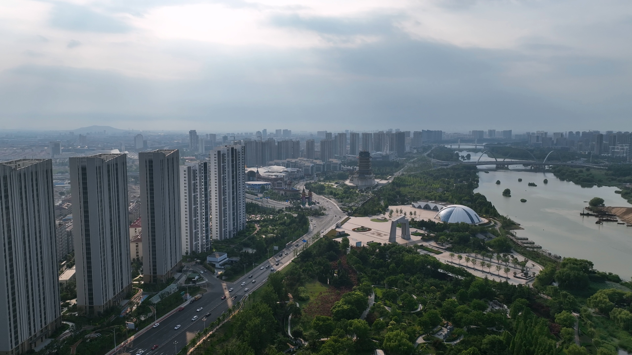 Source image for Aerial Cityscape with River Park and High Rise Towers Under Overcast Sky