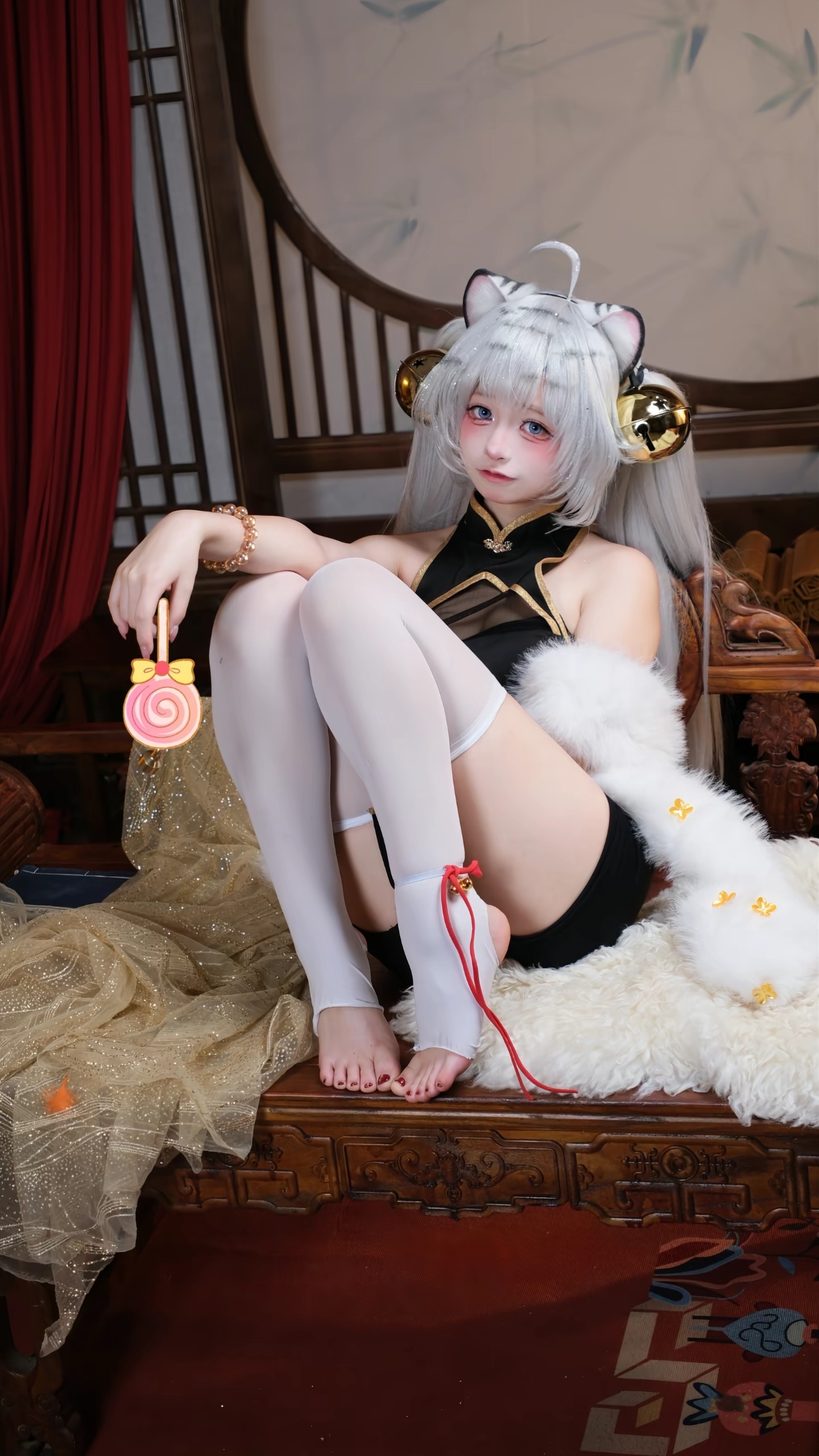 Source image for Cat Girl Cosplayer Wiggles Ears and Rings Lollipop Bell