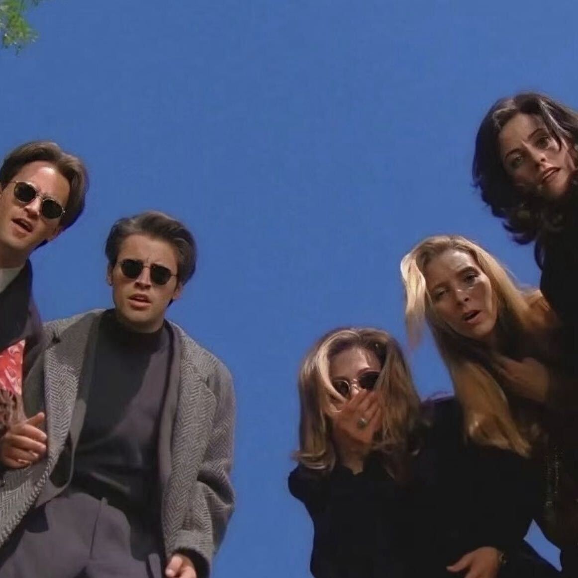 Source image for Friends Looking Down From Low Angle Against Blue Sky