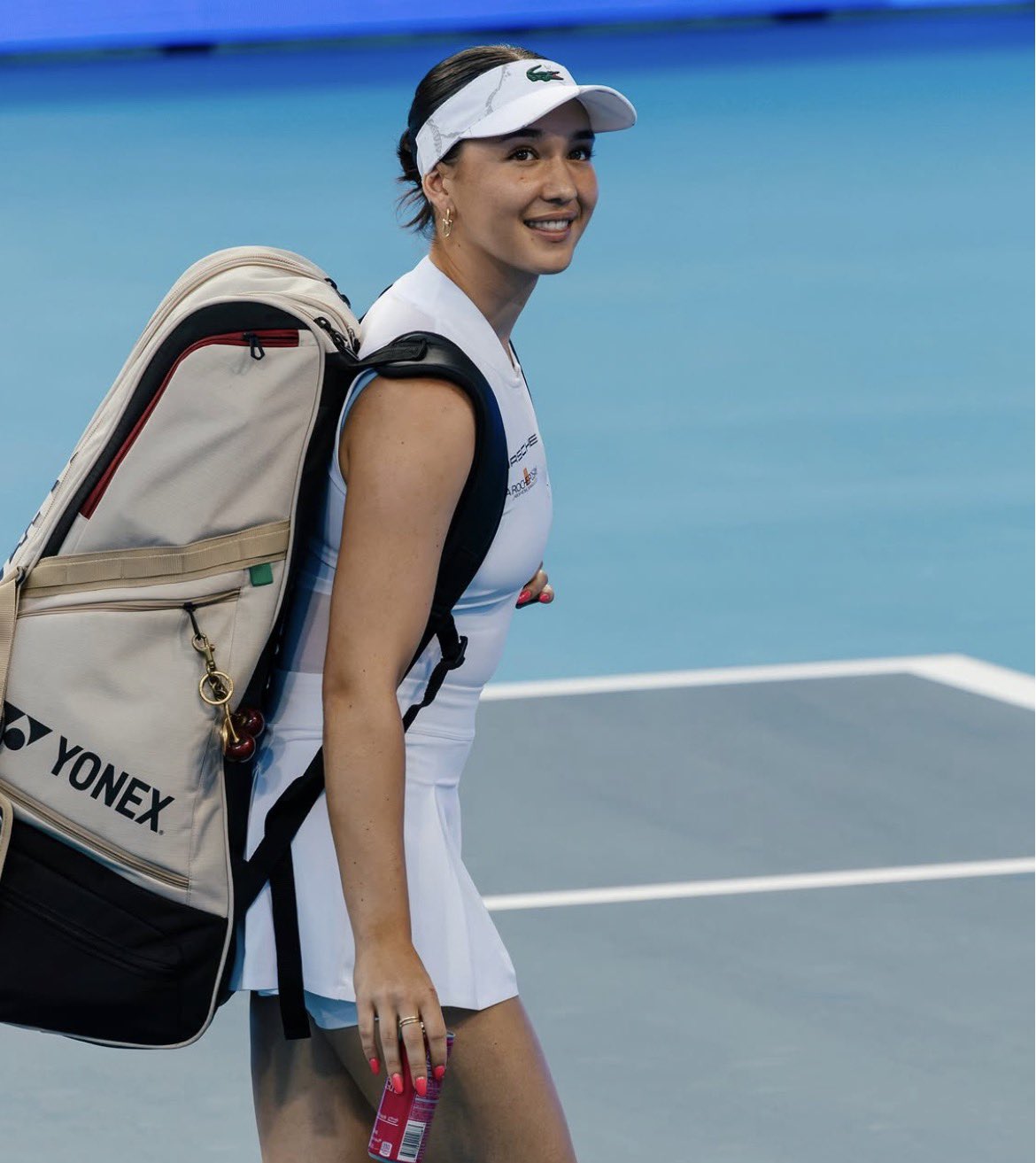 Source image for Tennis Player Smiling Backwards with Yonex Bag and Cherry Charm