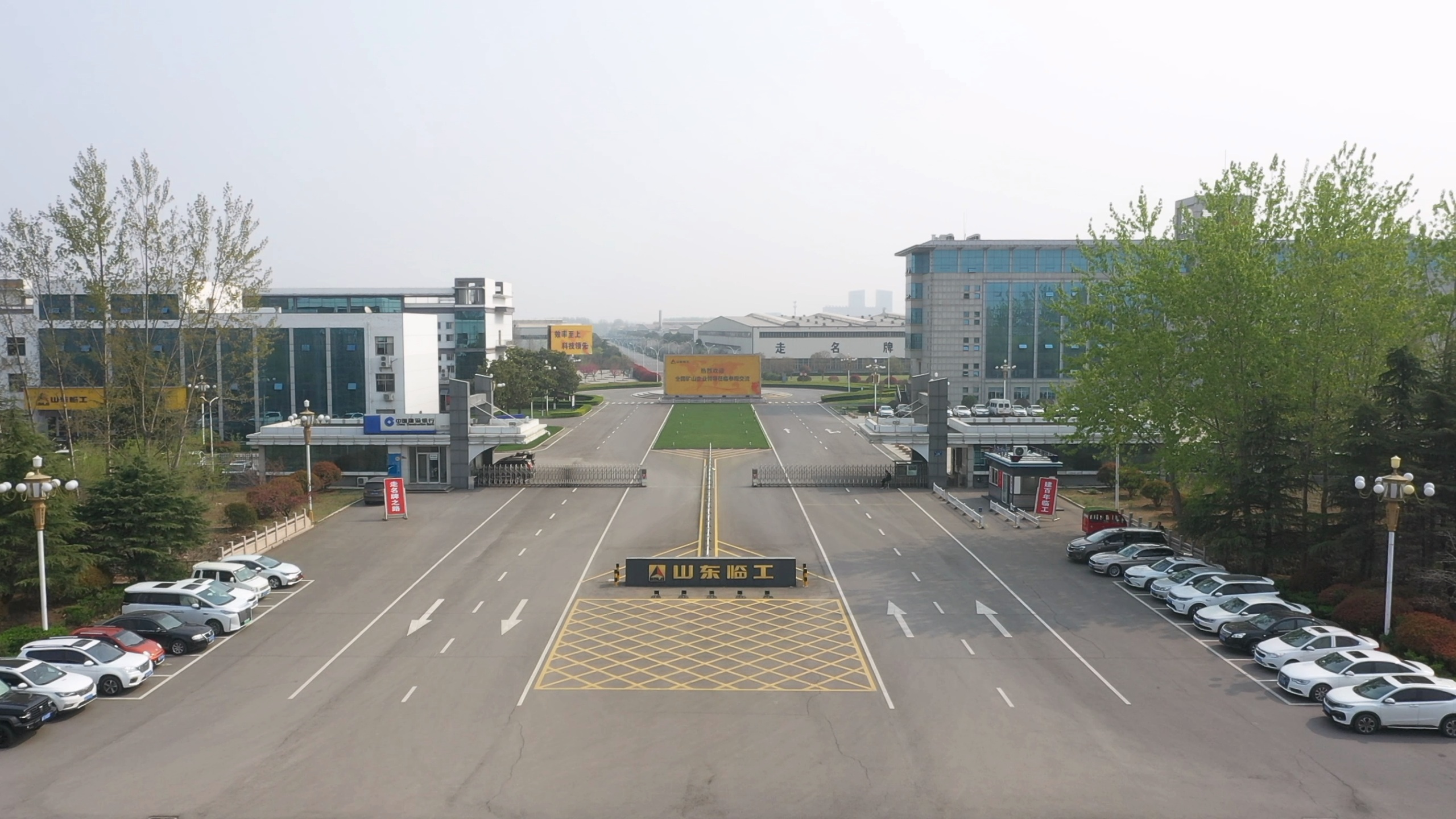 Source image for Industrial Gate Opens to Reveal Empty Highway and Parked Cars