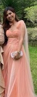 Source image for Woman in Peach Gown Standing Straight Facing Front Outdoors