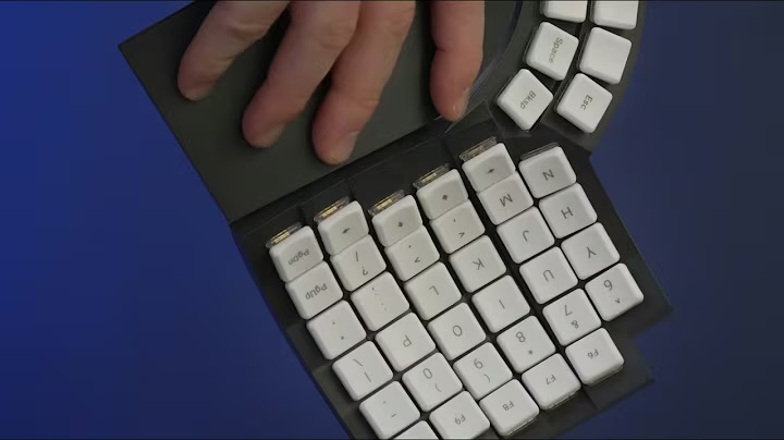Source image for Hand Demonstrates Flexibility of Foldable White Keyboard Prototype
