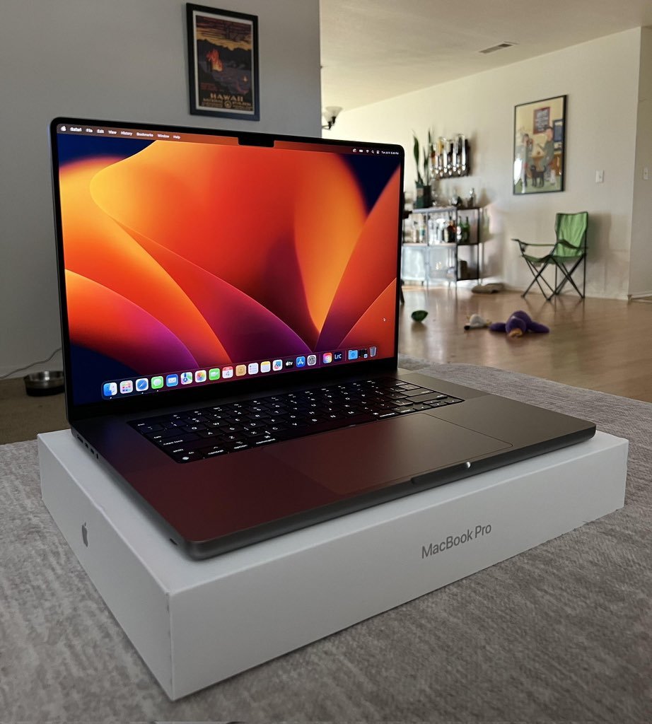 Source image for MacBook Pro Unboxing Reveal with Vibrant Screen Wallpaper