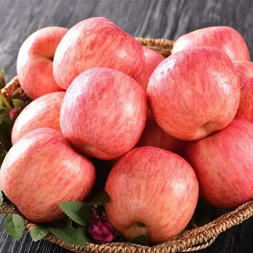 Source image for Wobbling Red Apples in a Woven Basket on Dark Wood