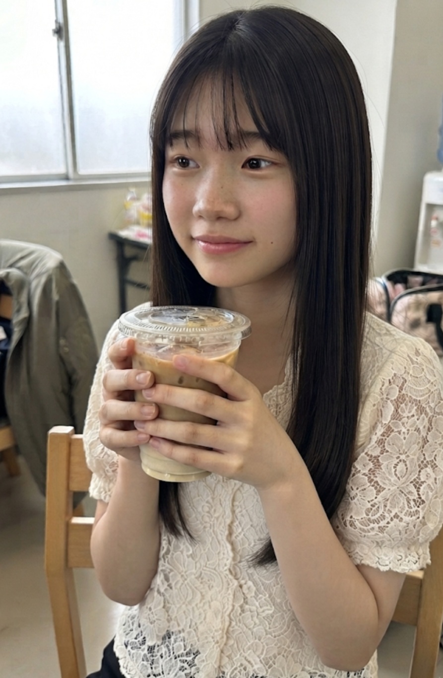 Source image for Girl Holding Iced Coffee Reacts to Sudden Off-Screen Distraction