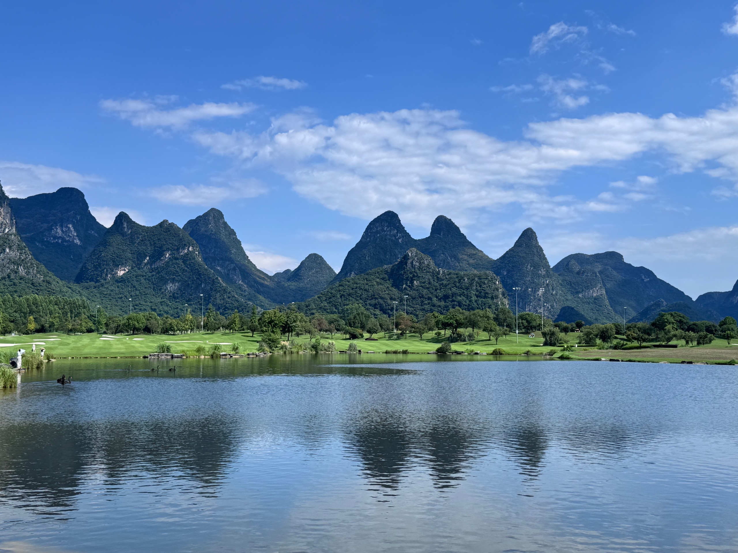 Source image for Serene Karst Mountains Reflecting in Golf Course Lake Water