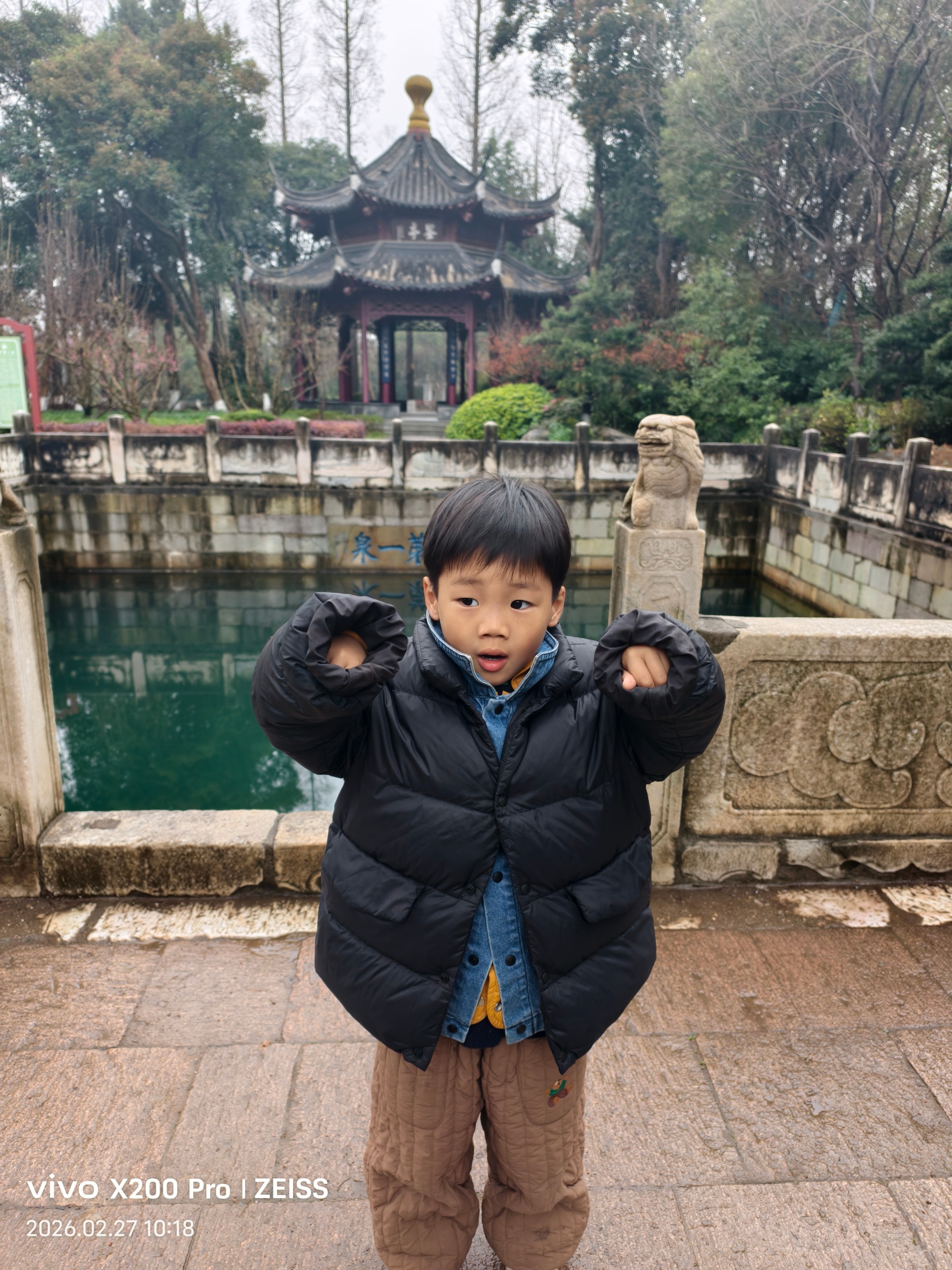 Source image for Toddler Posing Like a Strongman at Chinese Garden Pond