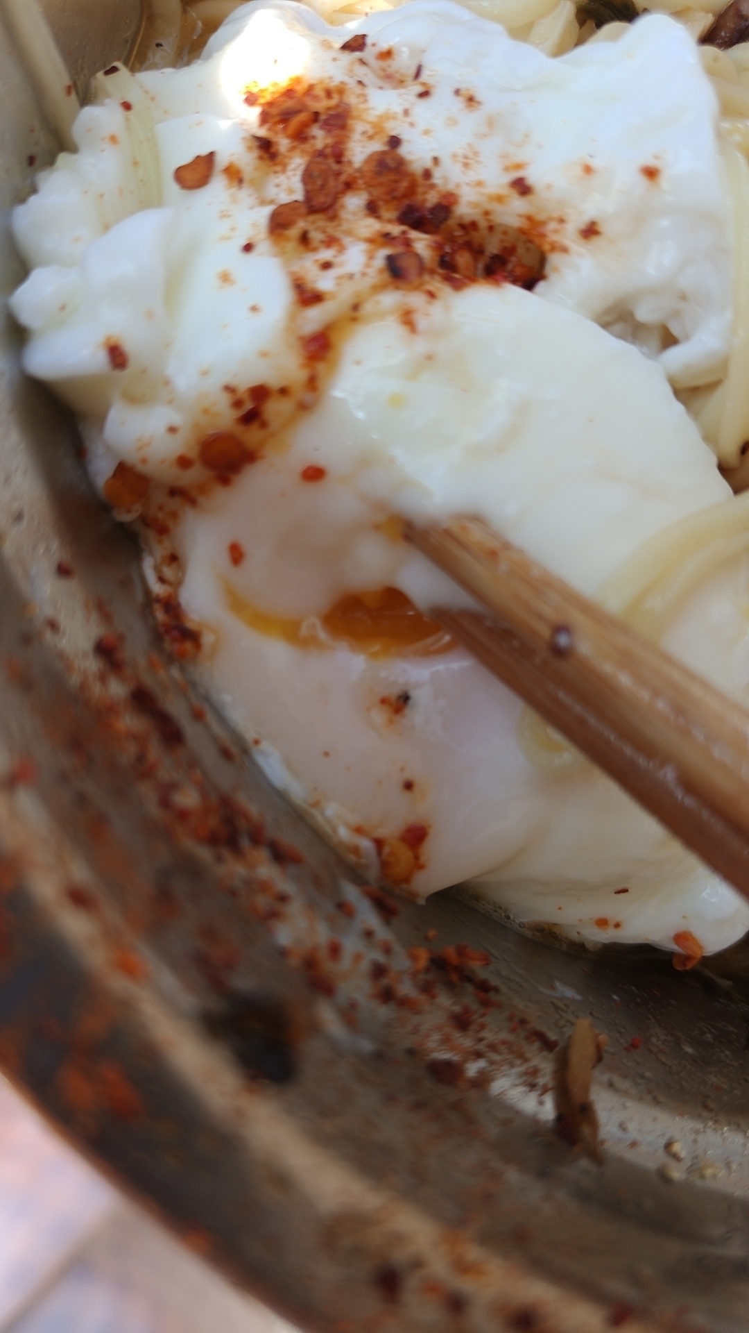 Source image for Chopsticks Puncture Runny Yolk on Spicy Fried Egg