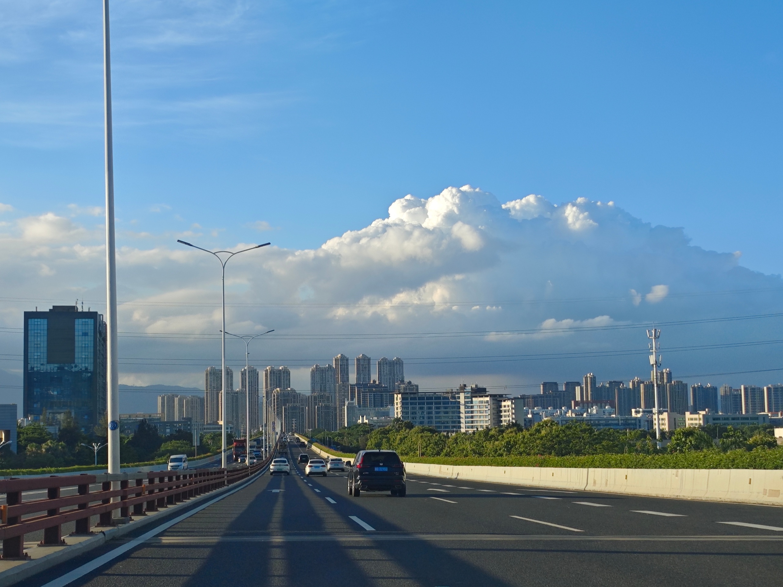 Source image for Highway Traffic Flowing Under Massive Cumulus Cloud Formation