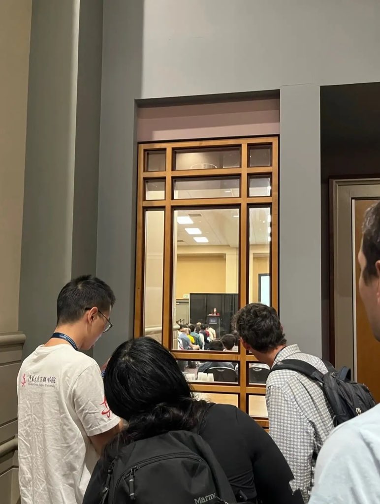 Source image for Curious Onlookers Peering Through Wood-Frame Window at Meeting Inside