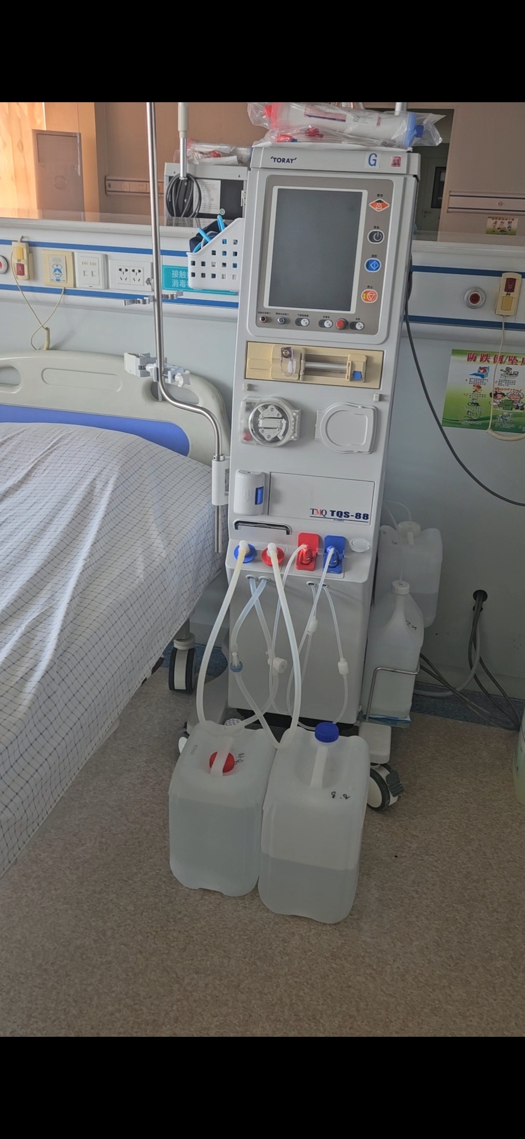 Source image for Toray Dialysis Machine Fluid Tubing and Containers in Hospital Room