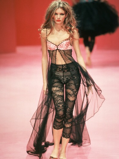 Source image for Model Struts Confidently in Black Lace Lingerie on Pink Runway