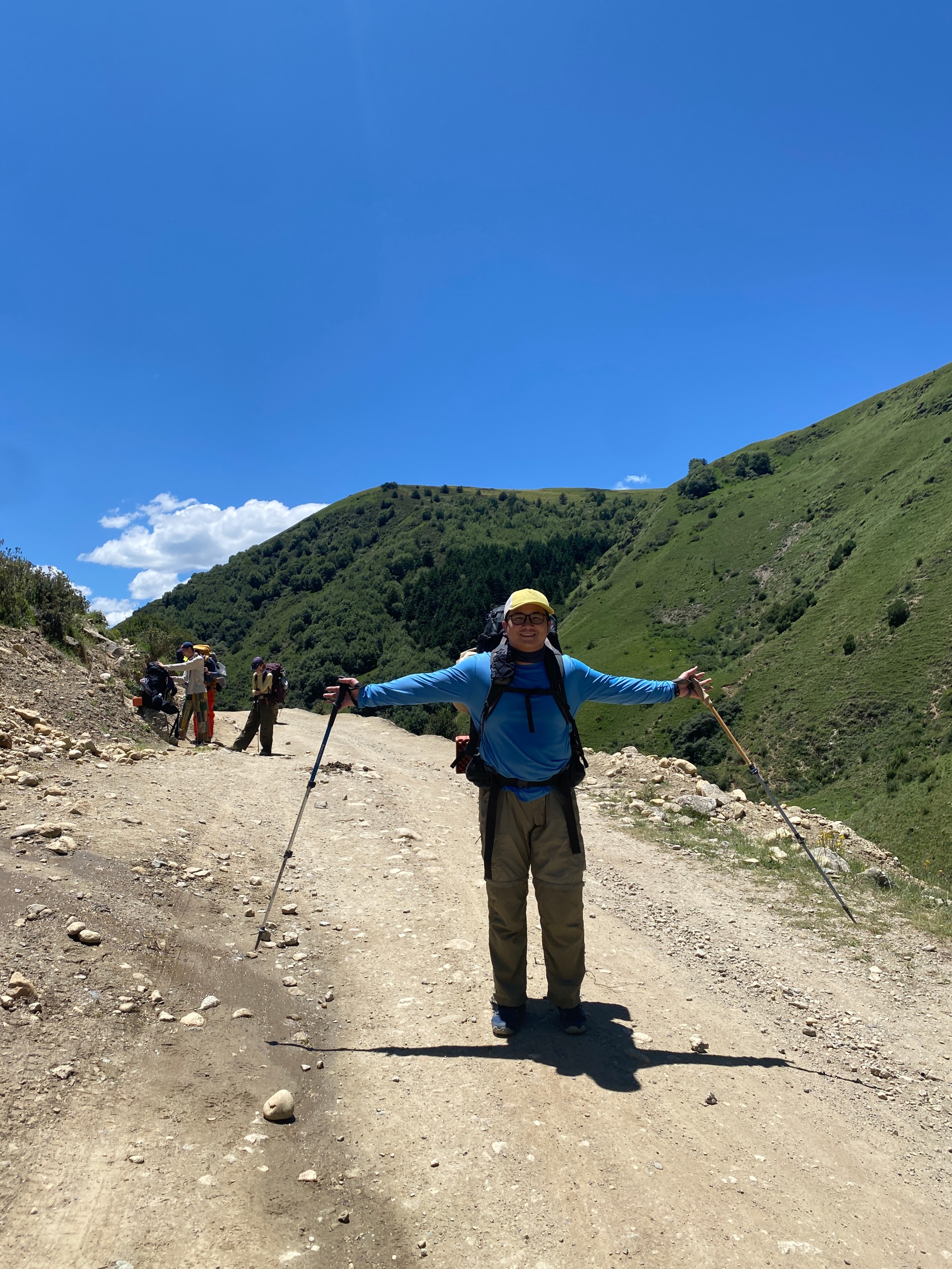 Source image for Hiker's Triumphant Arms Wide Pose on Mountain Trail
